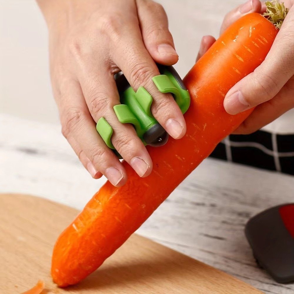 Kitchen Helper Gadgets - Obierak do warzyw w kształcie dłoni,